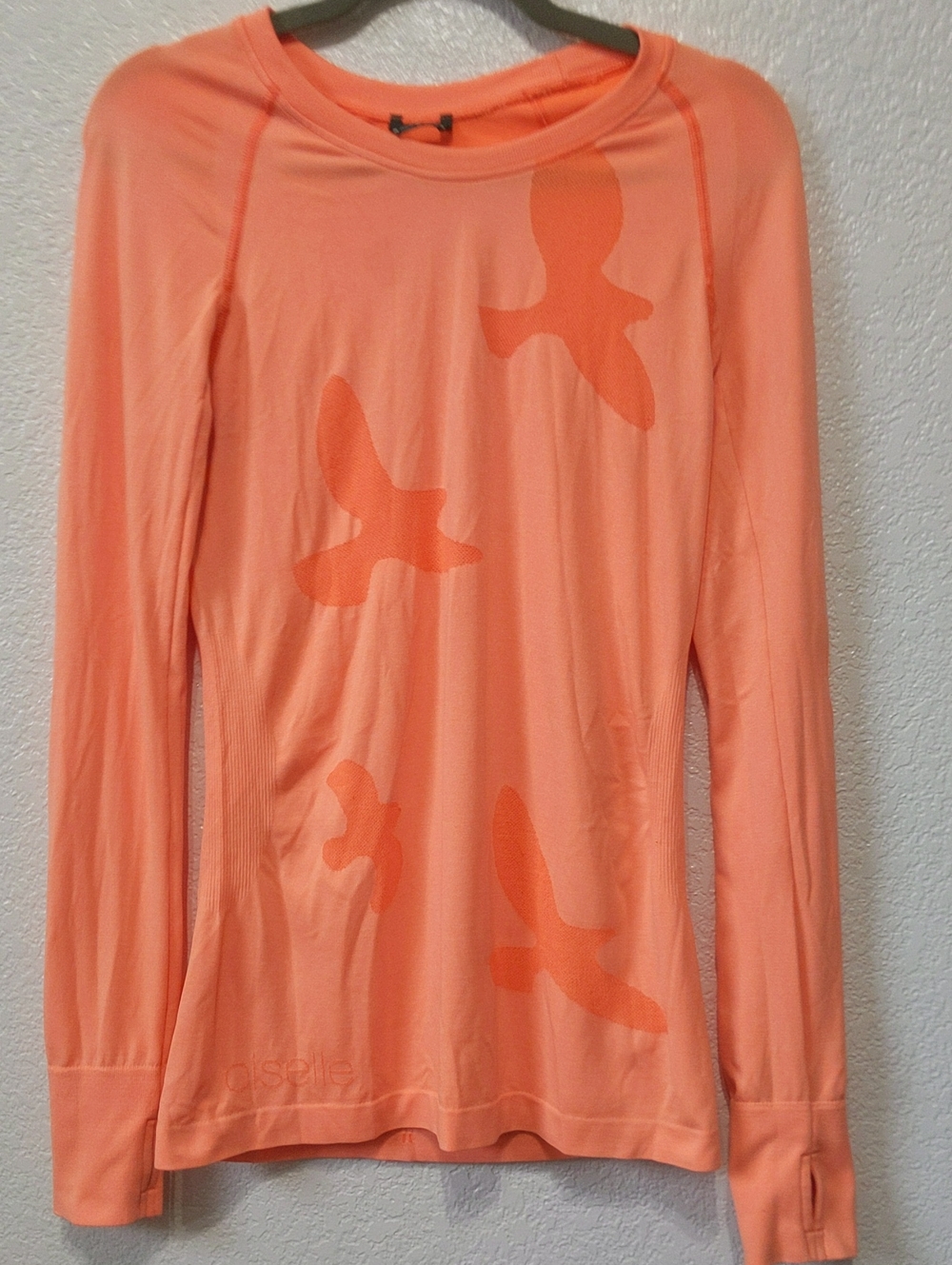 oiselle Flute coral Long Sleeve Performance Top with Bird Motif